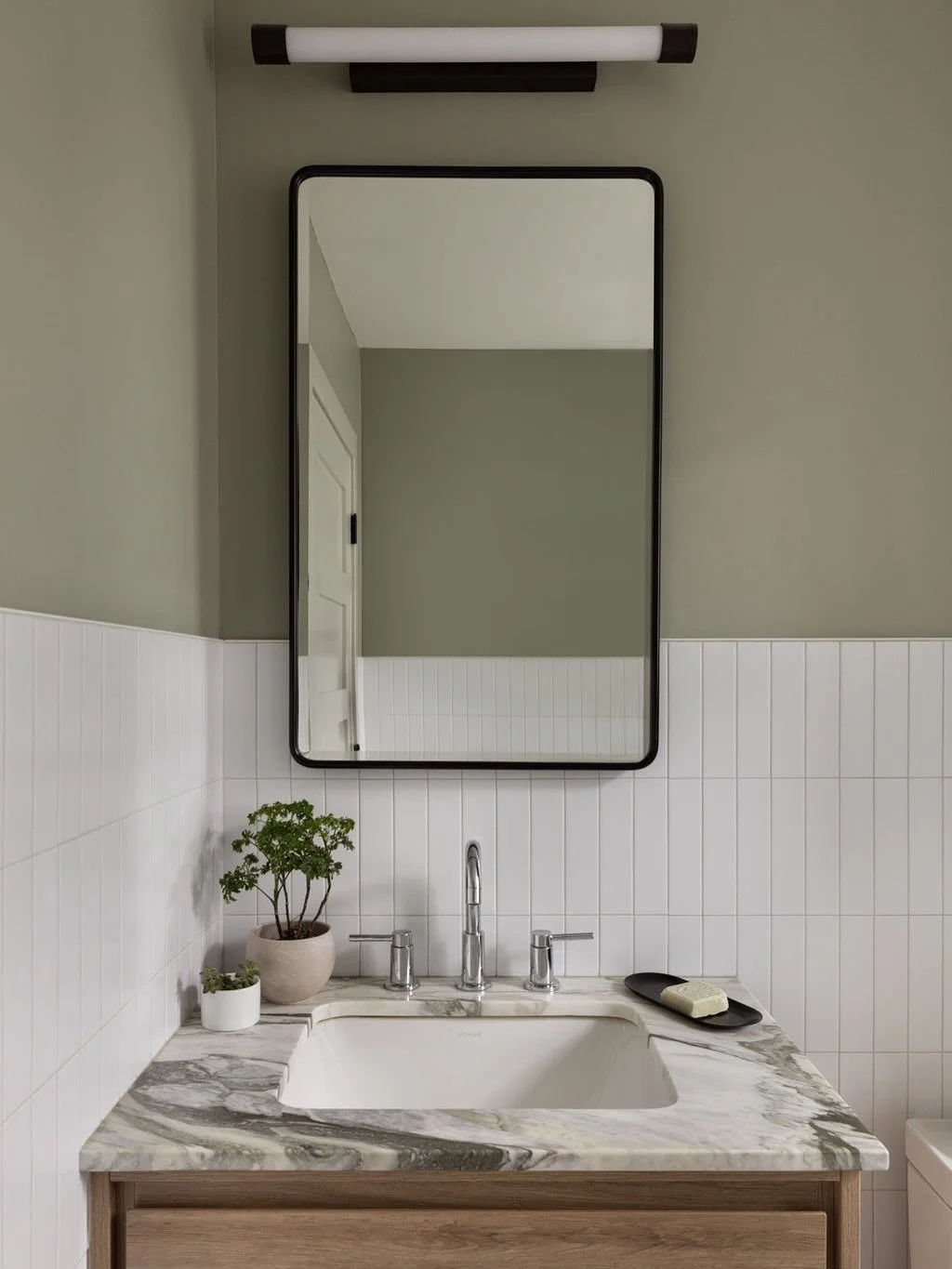 A compact bath where every inch earns its keep.⁠
⁠
In this converted three‑flat turned duplex, space was at a premium. Through integrating the laundry and custom millwork, we created a first‑floor zone that functions as a bath, mudroom, and dog wash 