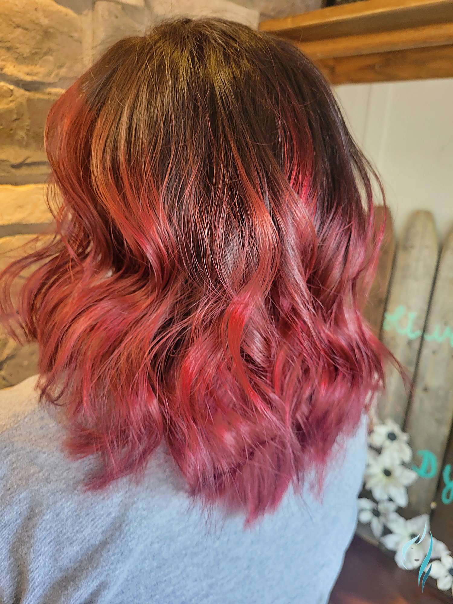 Magenta hair color melt with soft waves at Changing Times Hair Designs, State College, PA.