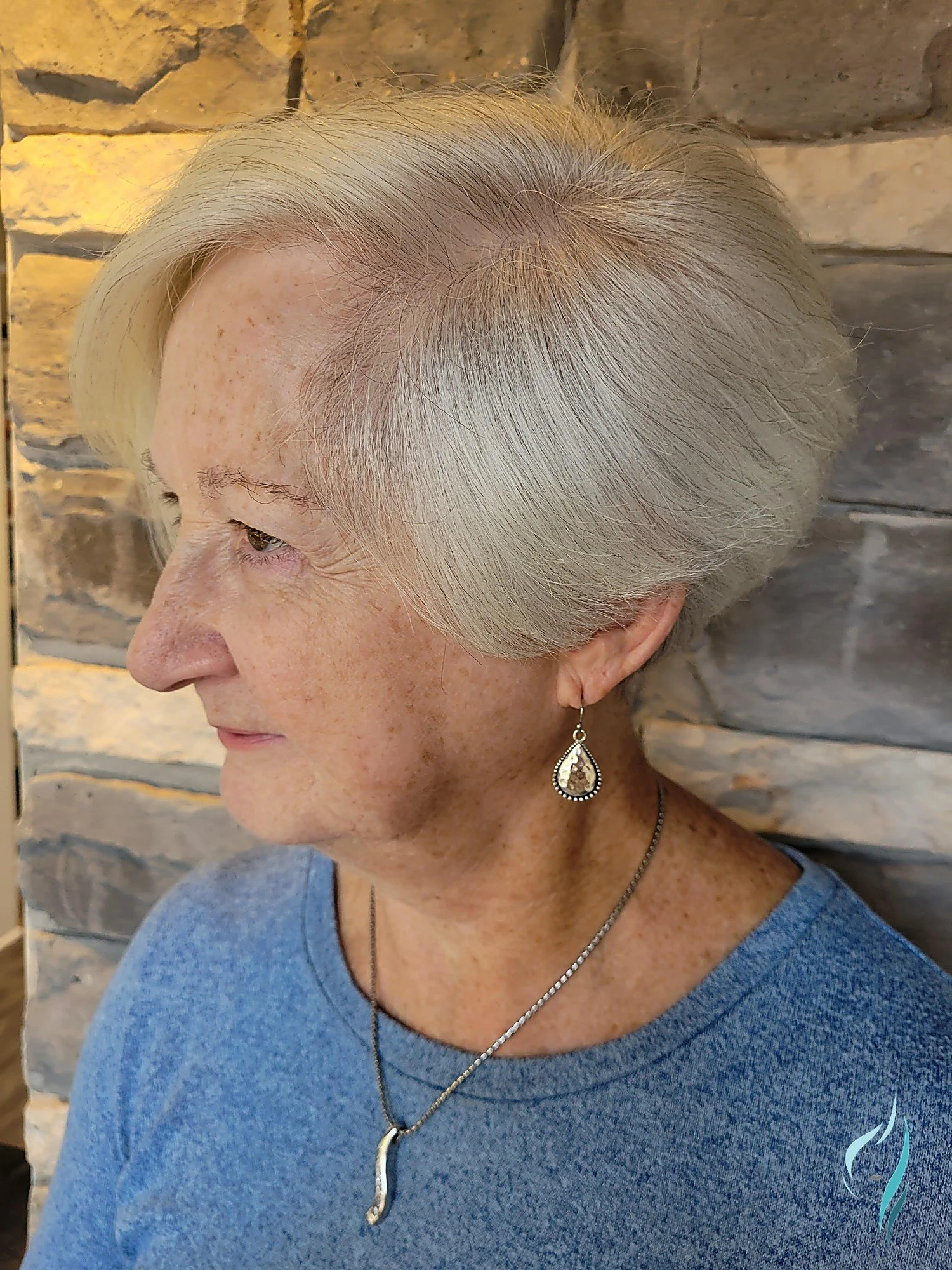 Precision cut short silver pixie style by Changing Times Hair Designs, State College, PA.
