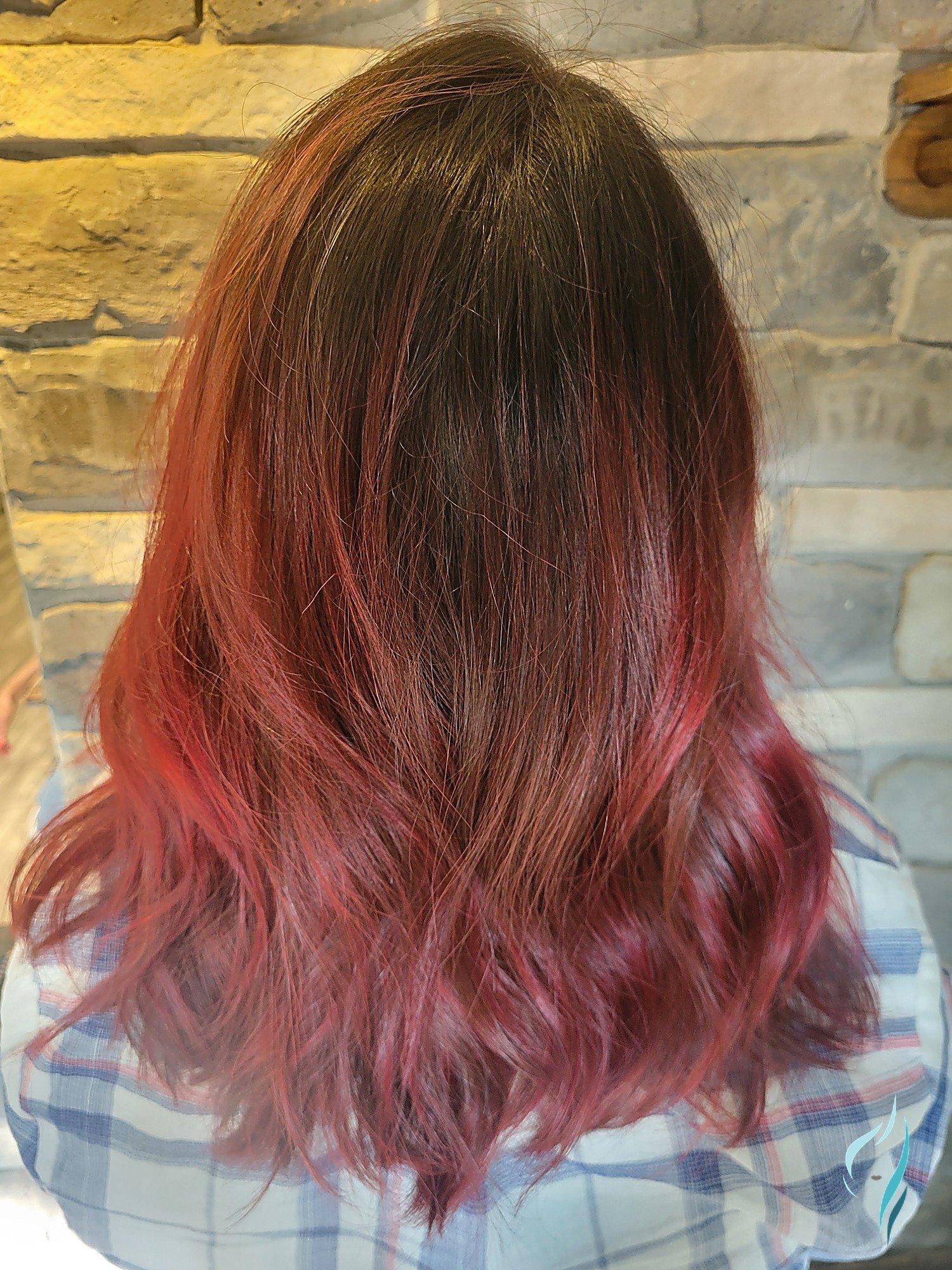 Cherry red color melt with soft waves at Changing Times Hair Designs, State College, PA.