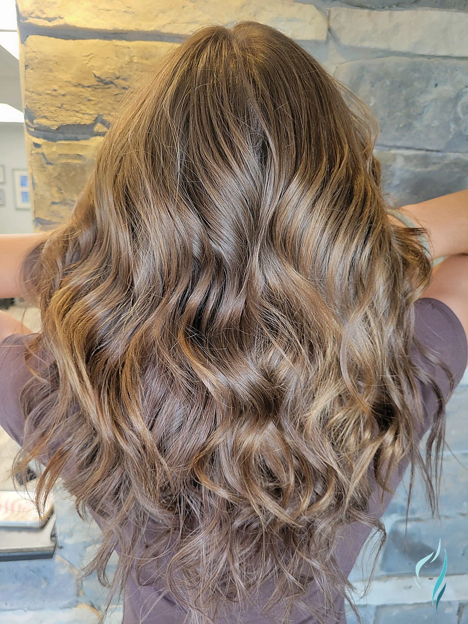 Dimensional blonde balayage with loose waves at Changing Times Hair Designs, State College, PA.