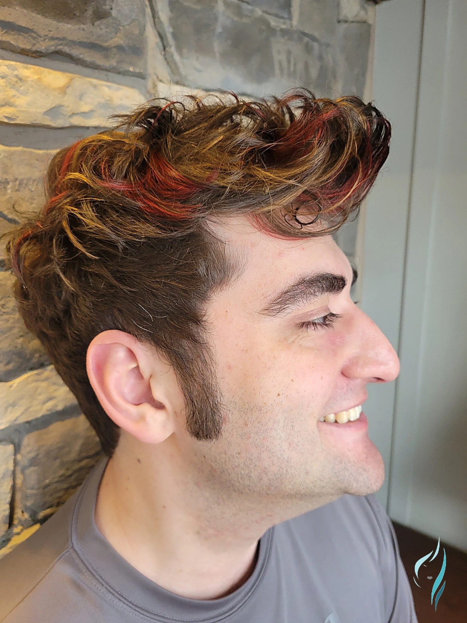 Textured men's cut with fiery red highlights by Changing Times Hair Designs, State College, PA.