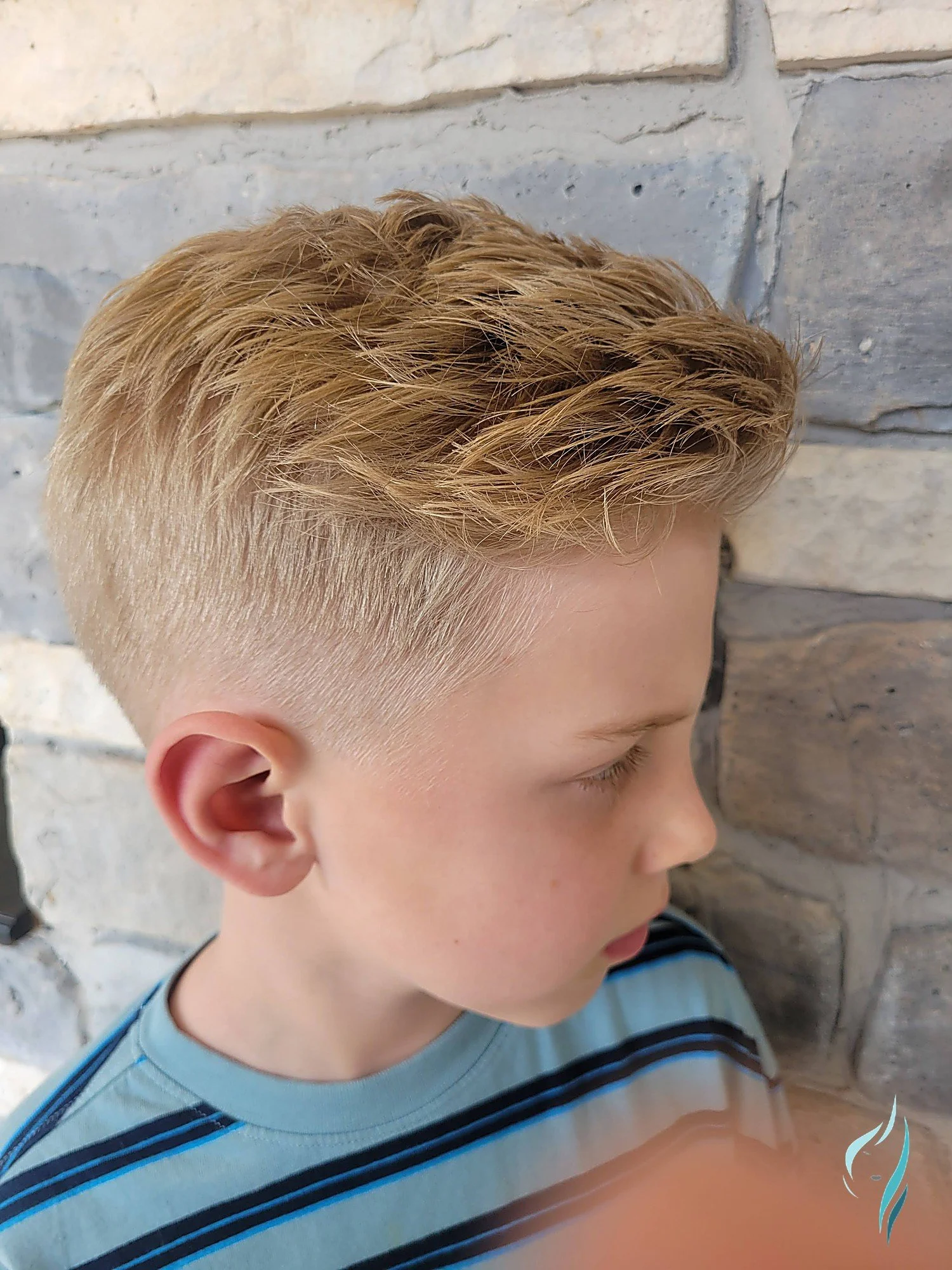 Blonde textured fade haircut at Changing Times Hair Designs, State College, PA.