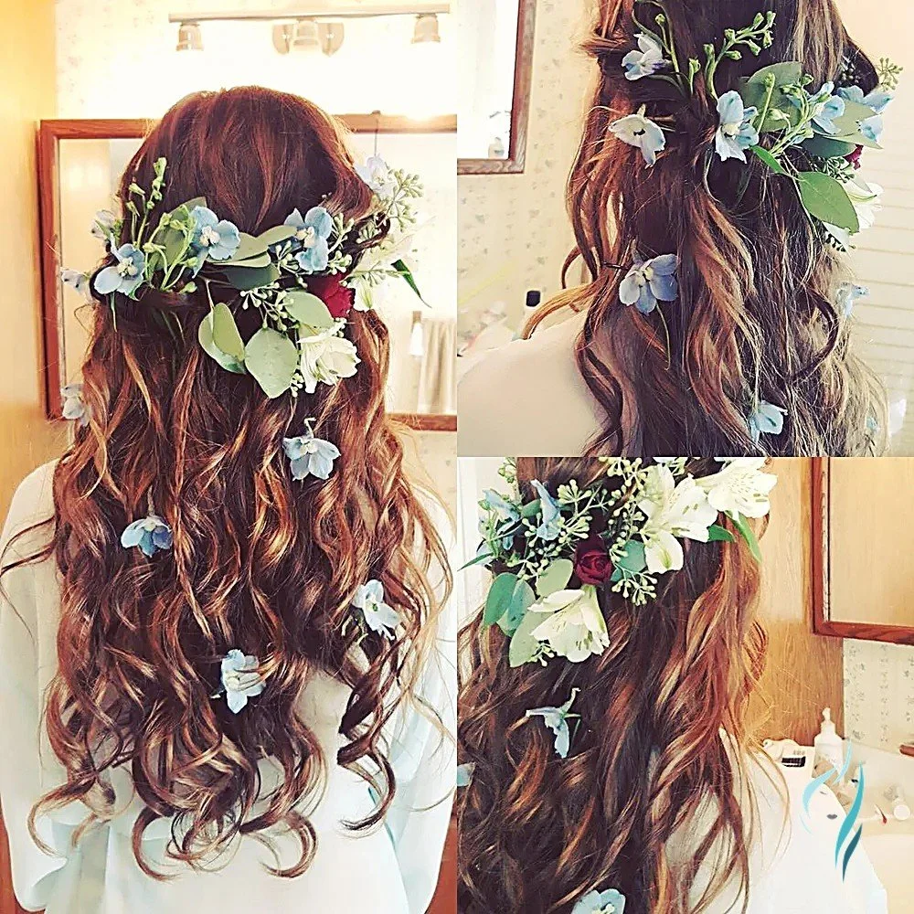 Romantic loose curls adorned with fresh flowers by Changing Times Hair Designs, State College, PA.