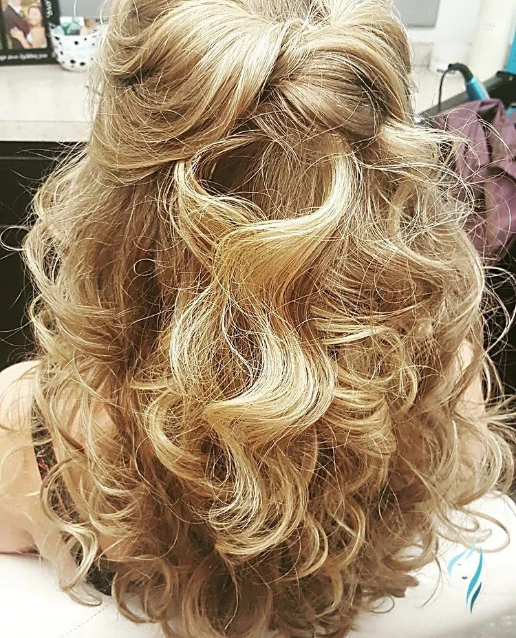 Half-up blonde hairstyle with soft romantic curls by Changing Times Hair Designs, State College, PA.