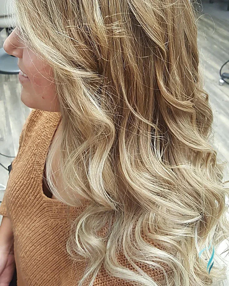 Dimensional blonde balayage with soft curls by Changing Times Hair Designs, State College, PA.