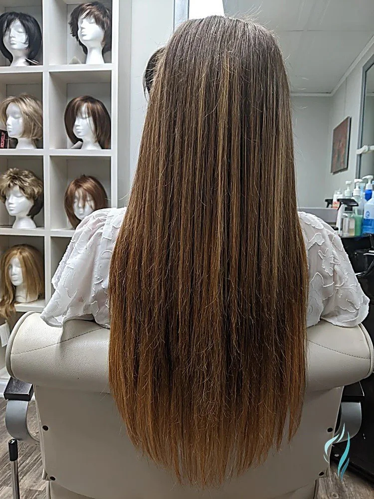 Long, straight brown hair with subtle golden highlights at Changing Times Hair Designs, State College, PA.