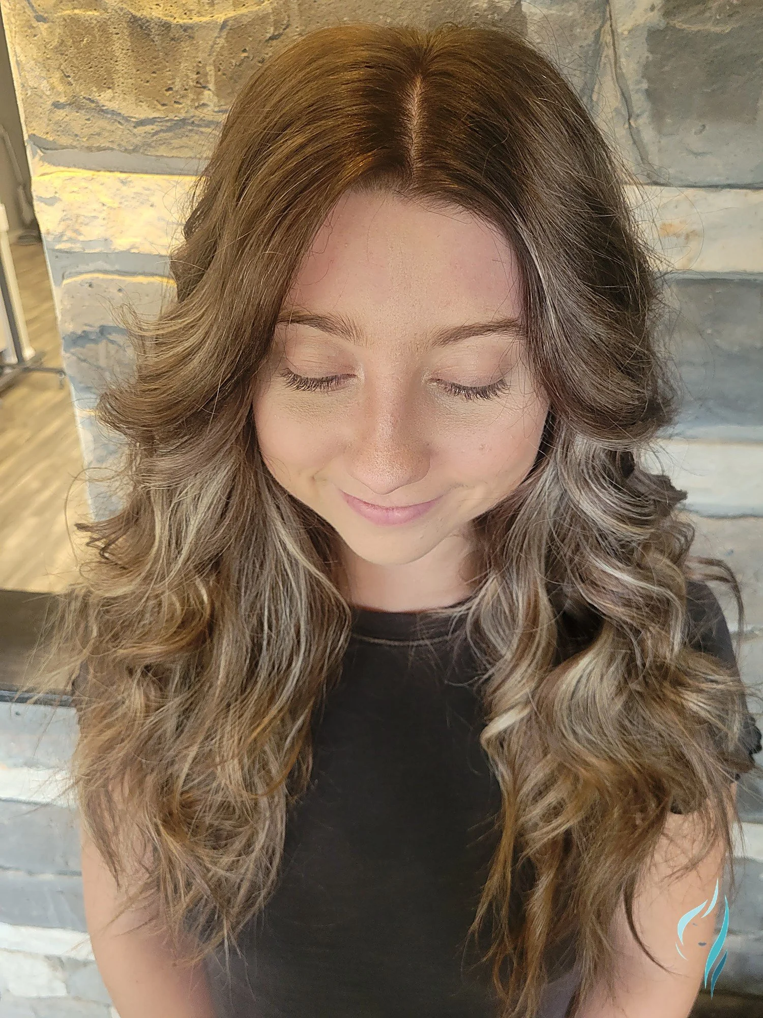 Dimensional balayage with honey highlights and long wavy hair at Changing Times Hair Designs, State College, PA.