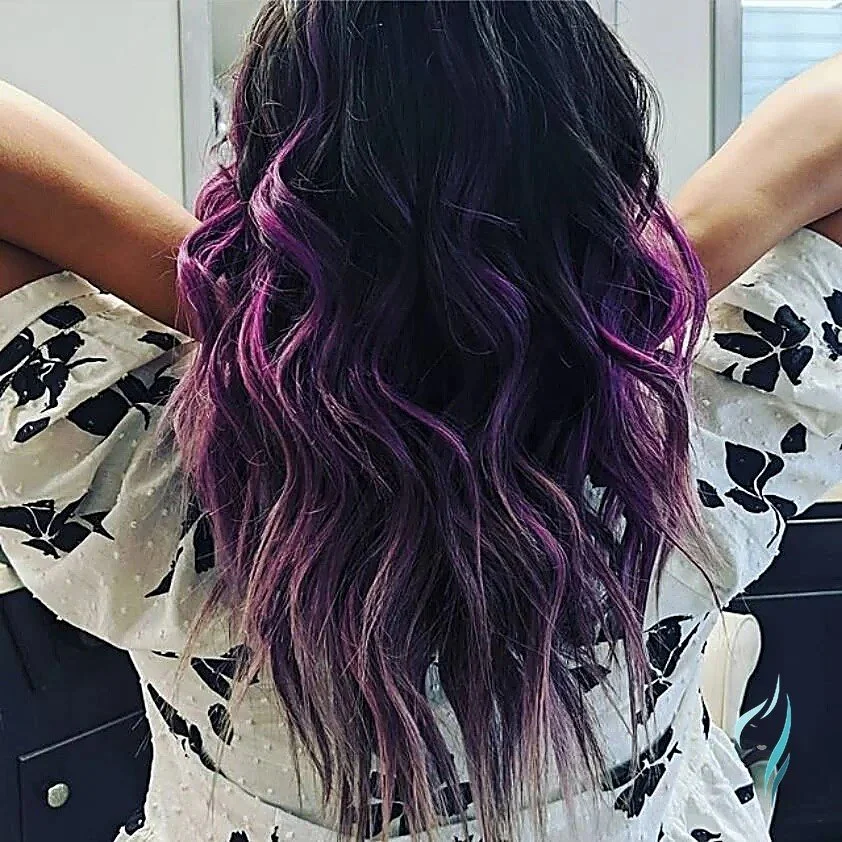 Dark hair with vibrant purple highlights at Changing Times Hair Designs, State College, PA.