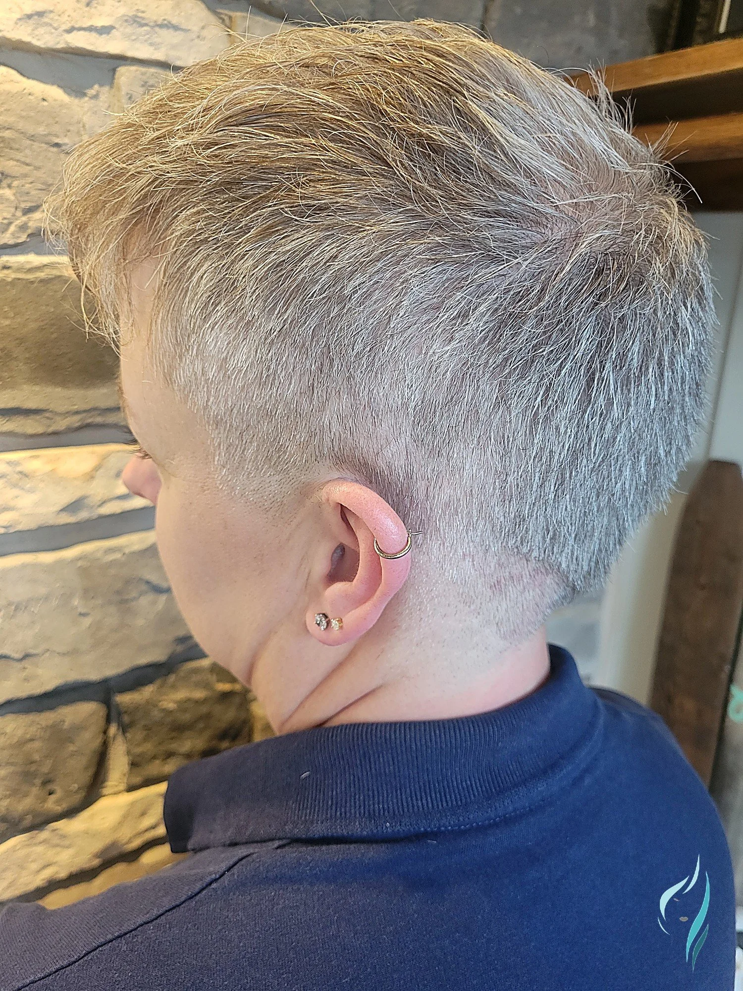 Short, silver, precision-tapered haircut at Changing Times Hair Designs, State College, PA.