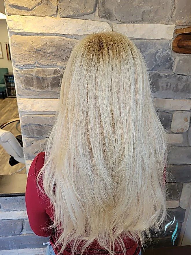 Long platinum blonde hair with a seamless root melt at Changing Times Hair Designs, State College, PA.