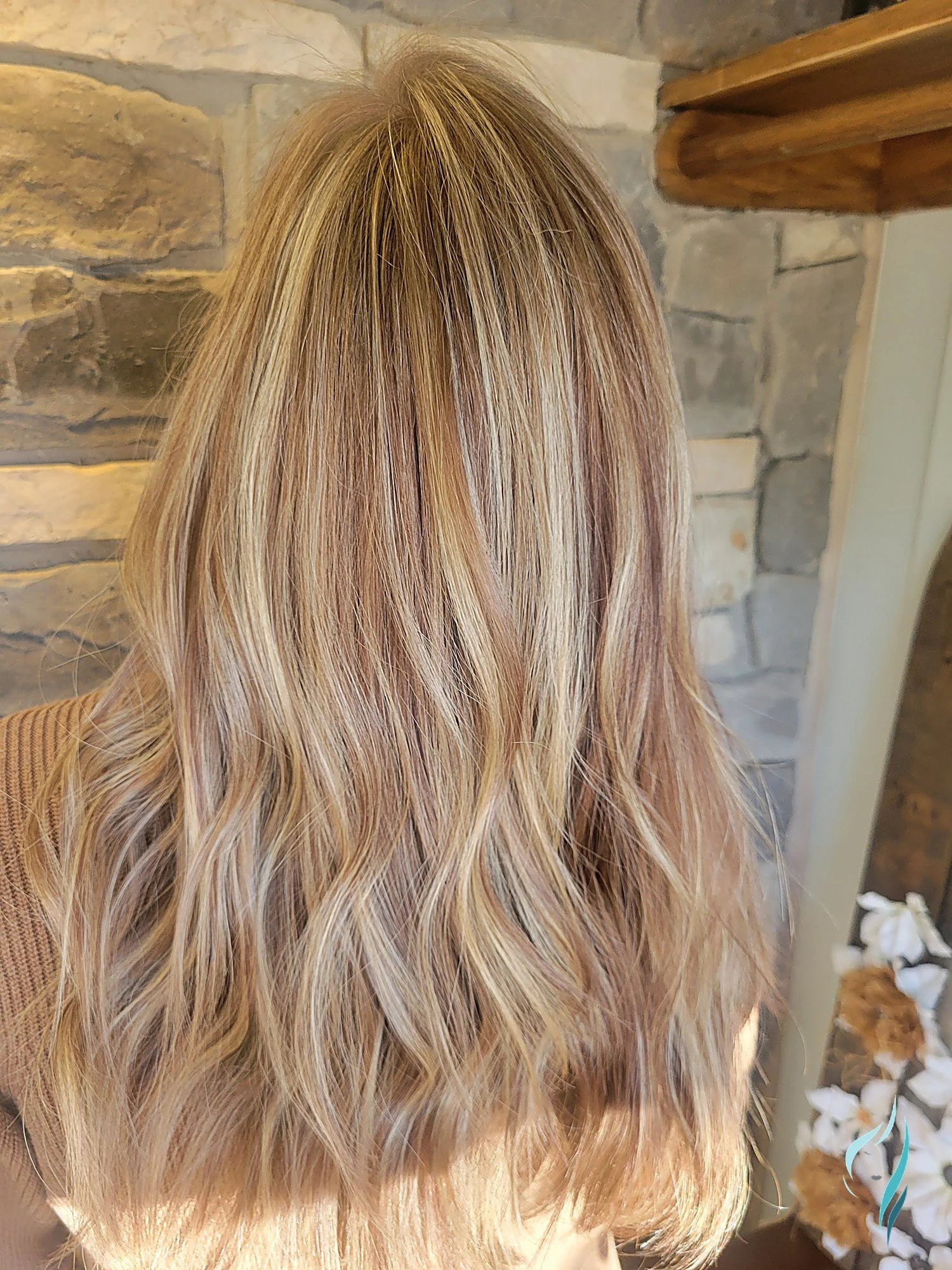 Dimensional blonde highlights with honey and platinum tones at Changing Times Hair Designs, State College, PA.