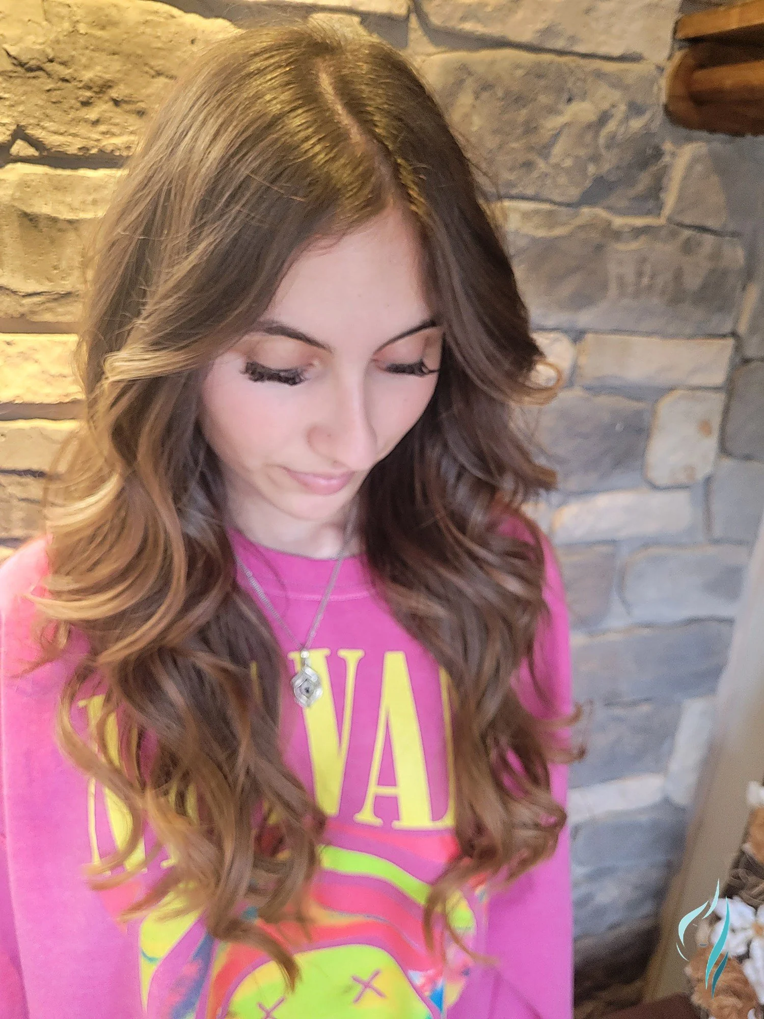 Dimensional balayage hair color with loose curls by Changing Times Hair Designs, State College, PA.