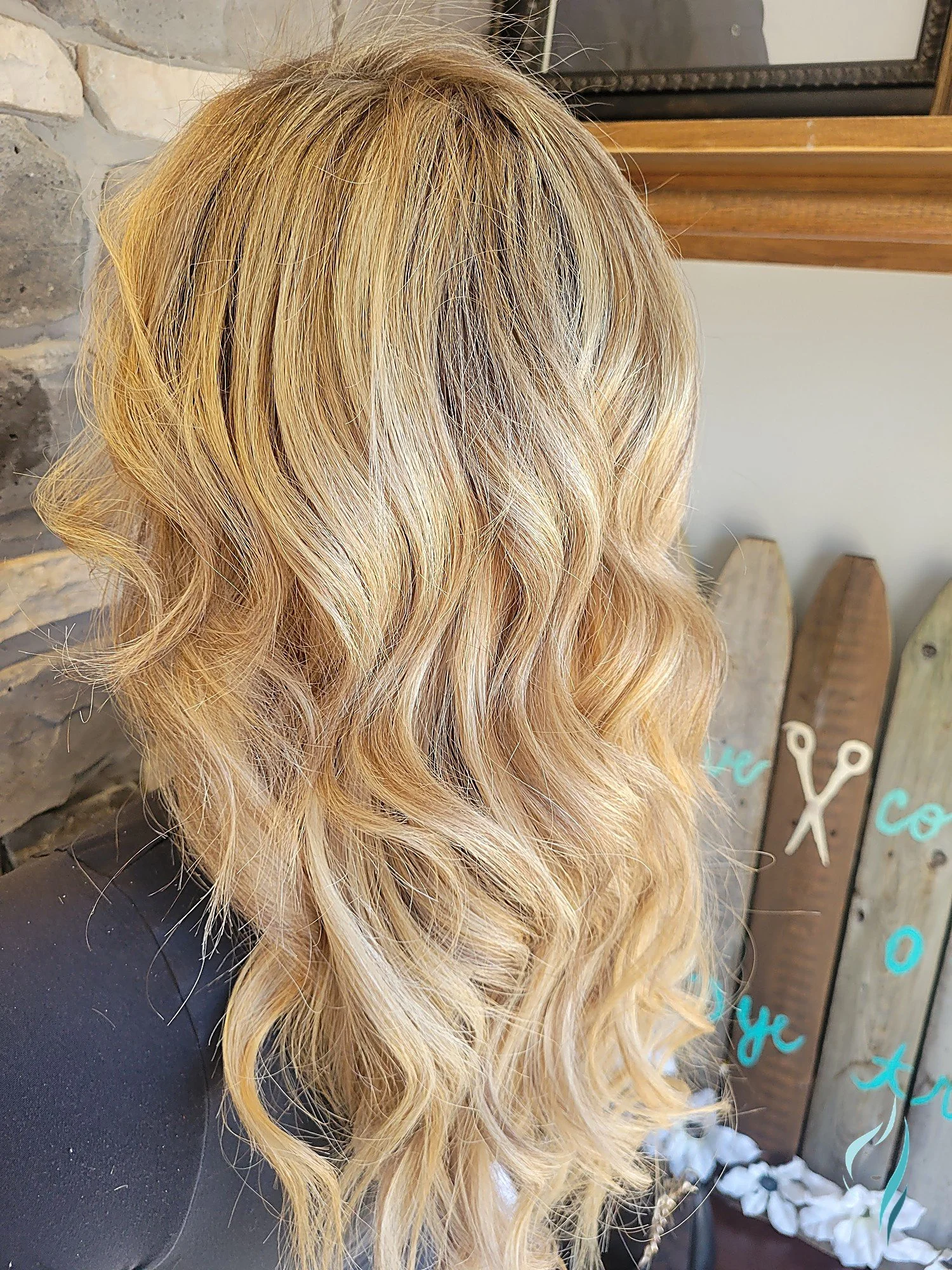 Dimensional blonde hair with soft waves by Changing Times Hair Designs, State College, PA.