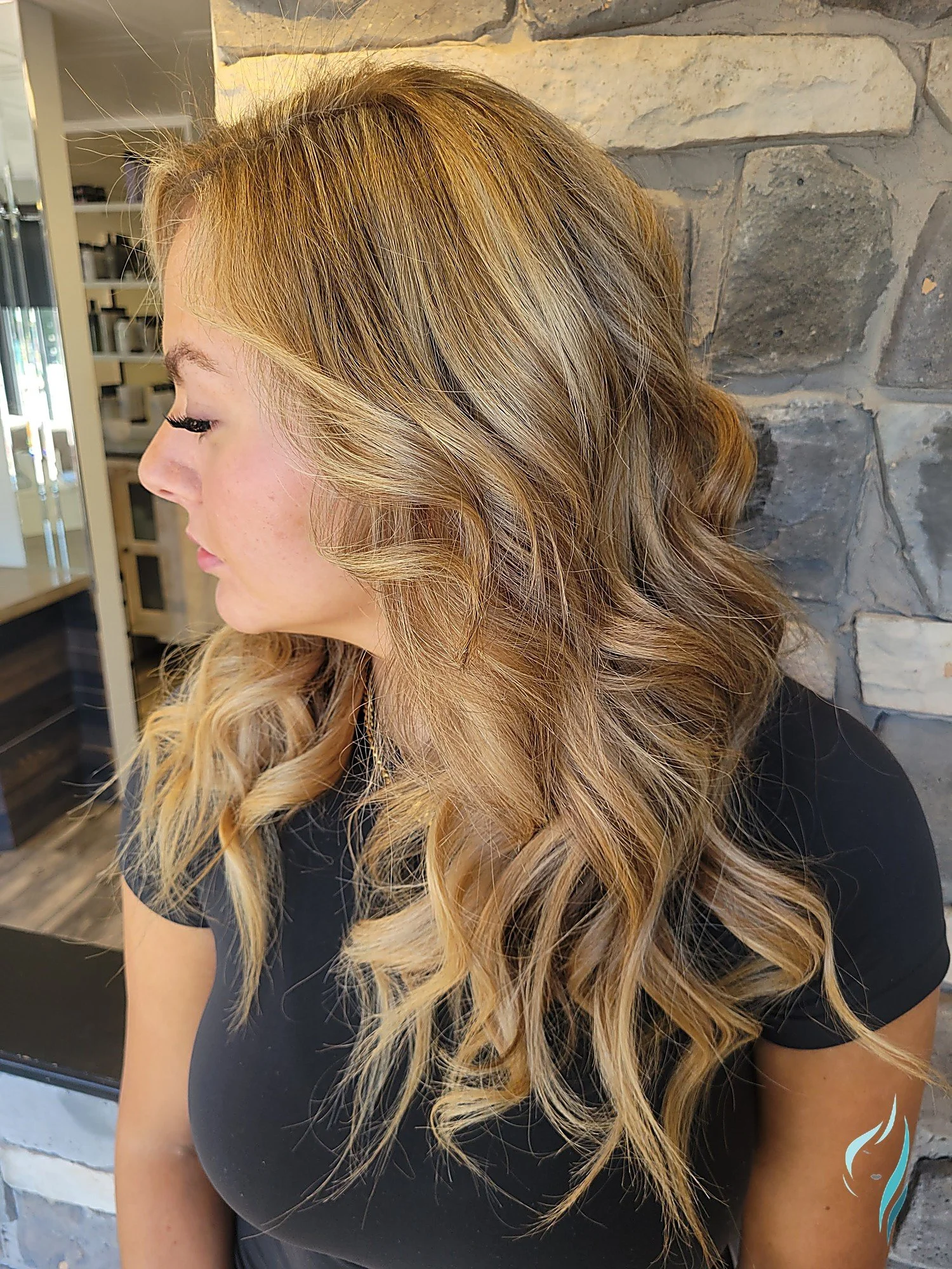 Sun-kissed dimensional blonde balayage hair at Changing Times Hair Designs, State College, PA.