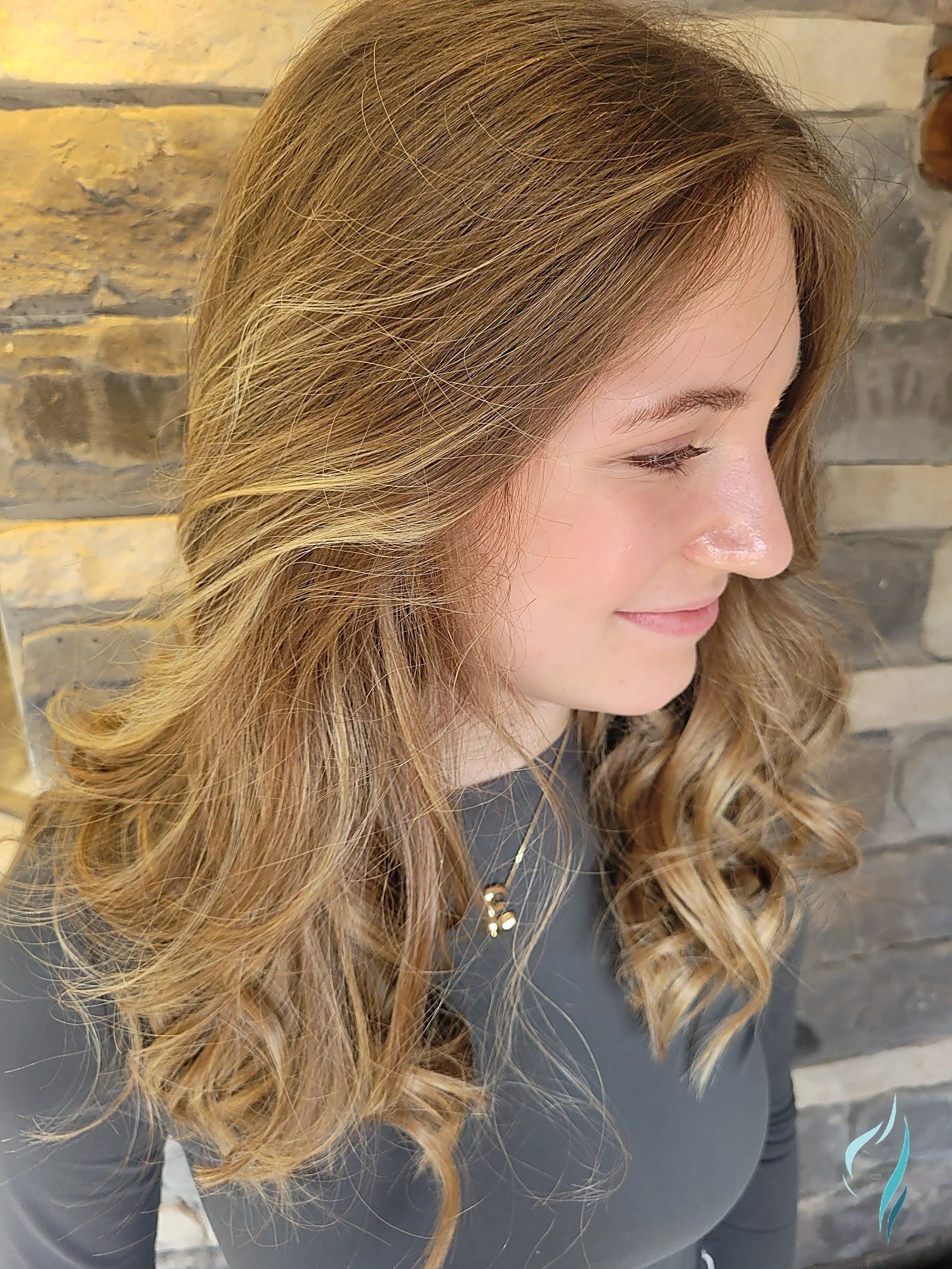 Dimensional blonde highlights with soft waves by Changing Times Hair Designs, State College, PA.