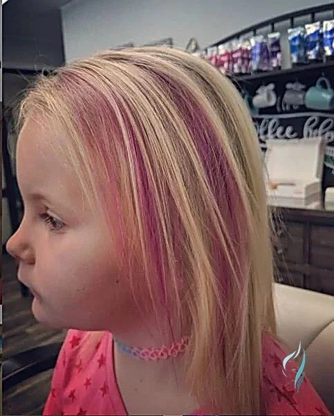 Blonde hair with bright pink highlights styled at Changing Times Hair Designs, State College, PA.