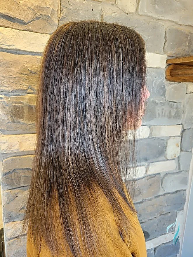 Dimensional brunette hair with subtle highlights at Changing Times Hair Designs, State College, PA.