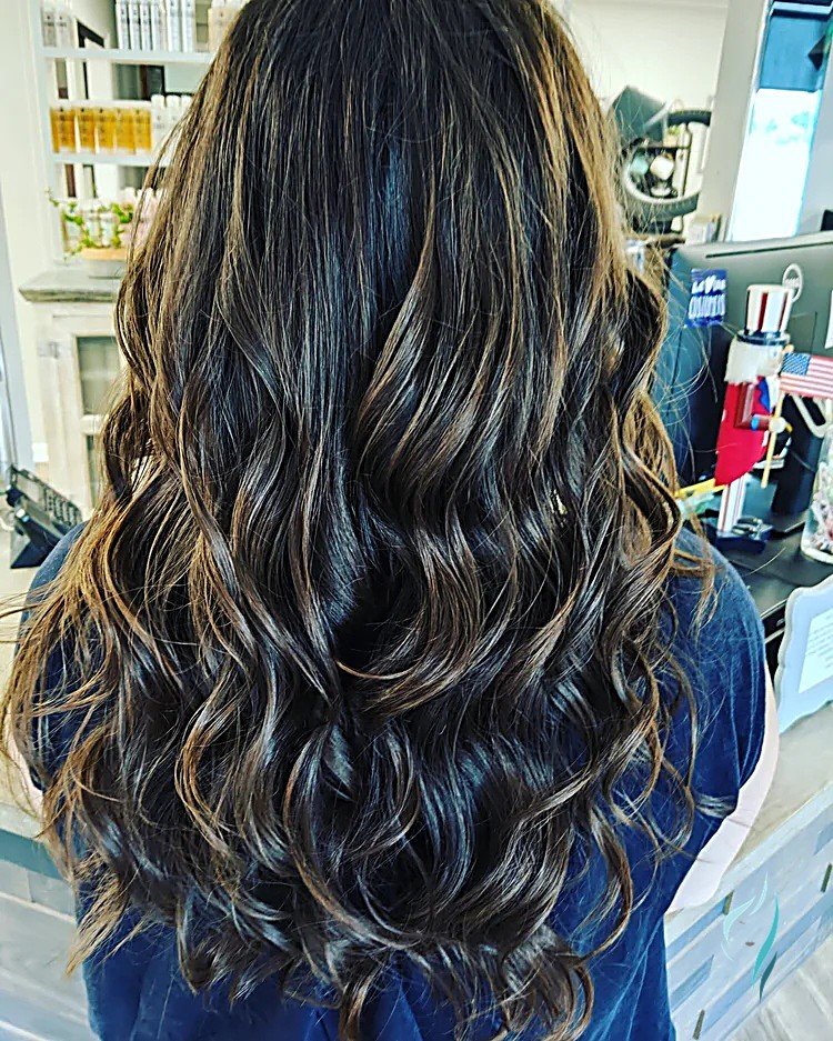 Rich brunette balayage with soft waves by Changing Times Hair Designs, State College, PA.