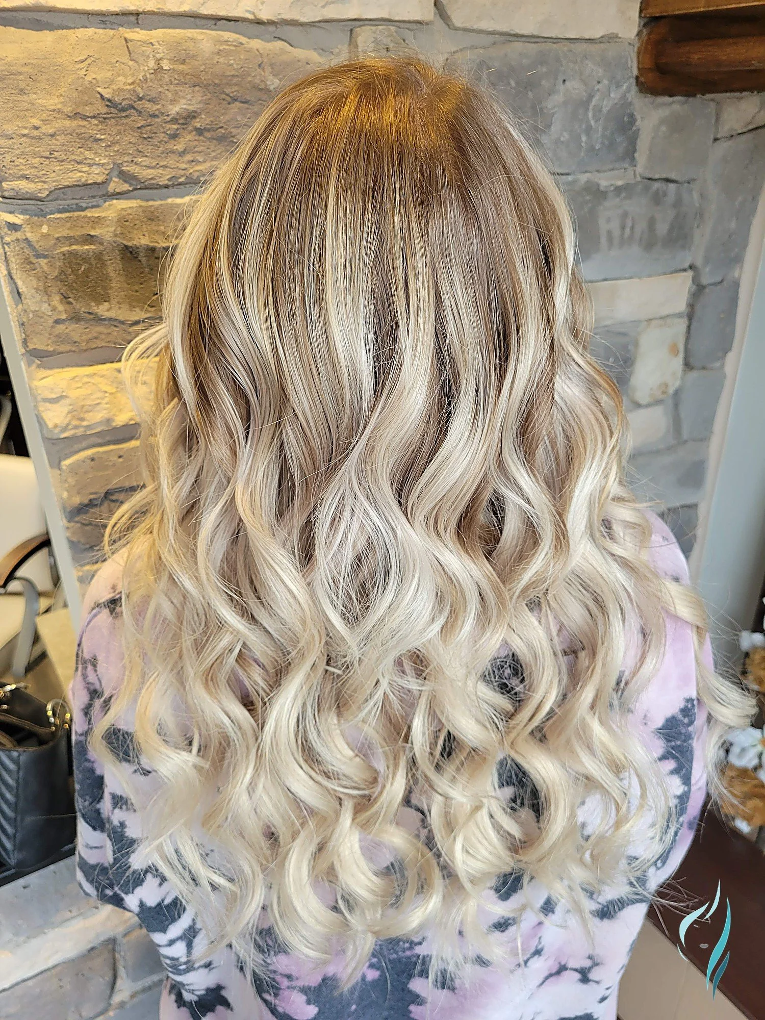 Blonde balayage with soft curls by Changing Times Hair Designs, State College, PA.