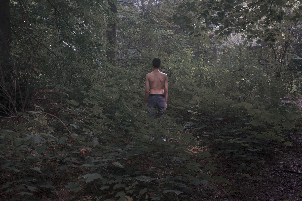 Mohamed, exiting a public park, is dating a German man in his late 60s. This image is from undocumented, a series that explores refugees and gay prostitution in Germany.