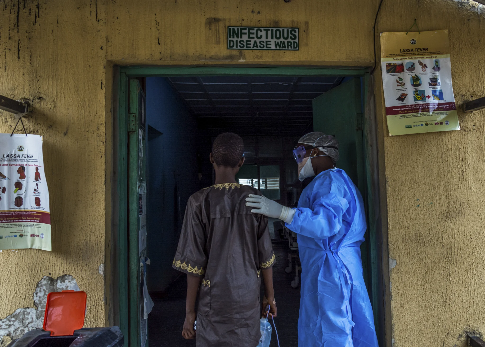 ETINOSA YVONNE www.etinosayvonne.me | @etinosa.yvonne A nurse accompanies a patient suspected to have Lassa fever to the isolation ward at the Federal Medical Center in Owo, Ondo state, in March 2018. During the first quarter of 2018, Nigeria experienced the worst outbreak of Lassa fever in 49 years. The outbreak led to the death of over a 100 people in different parts of the country.