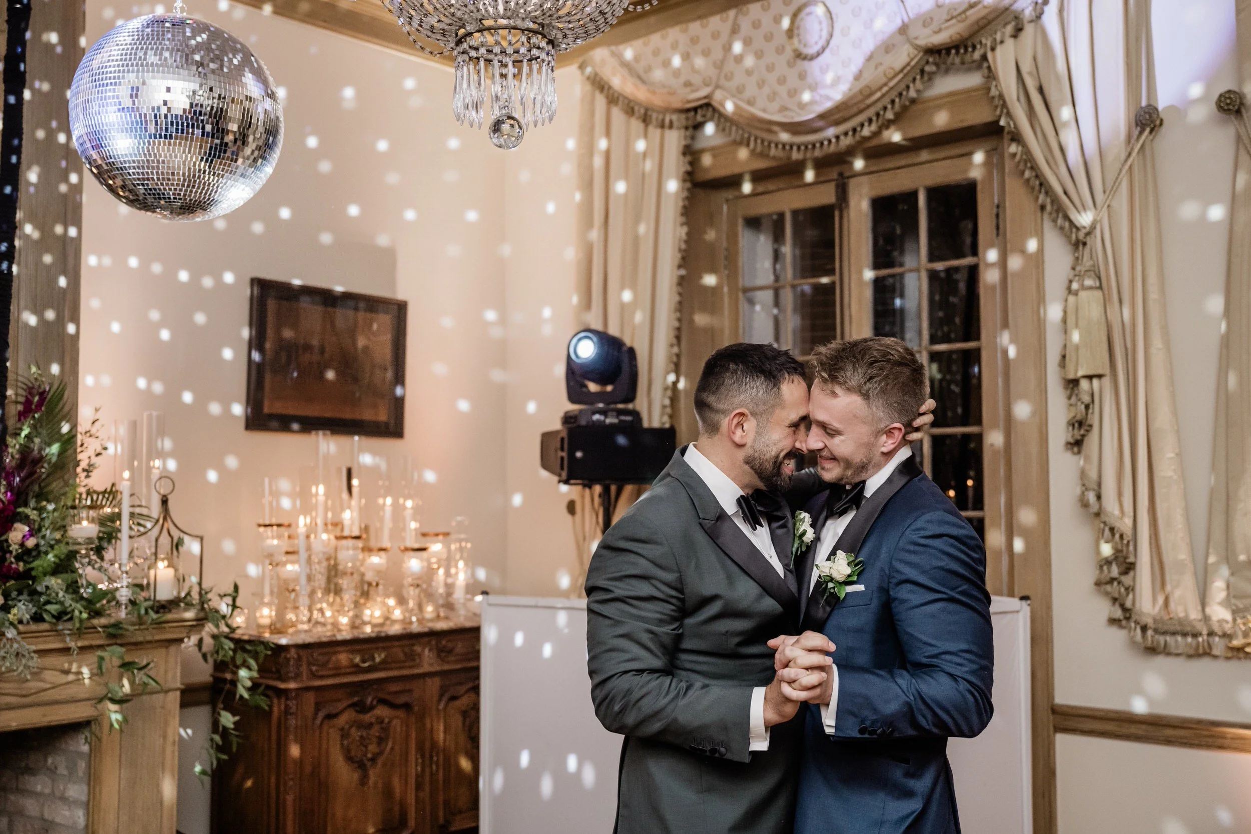 Newlyweds smiling as they dance at their wedding reception