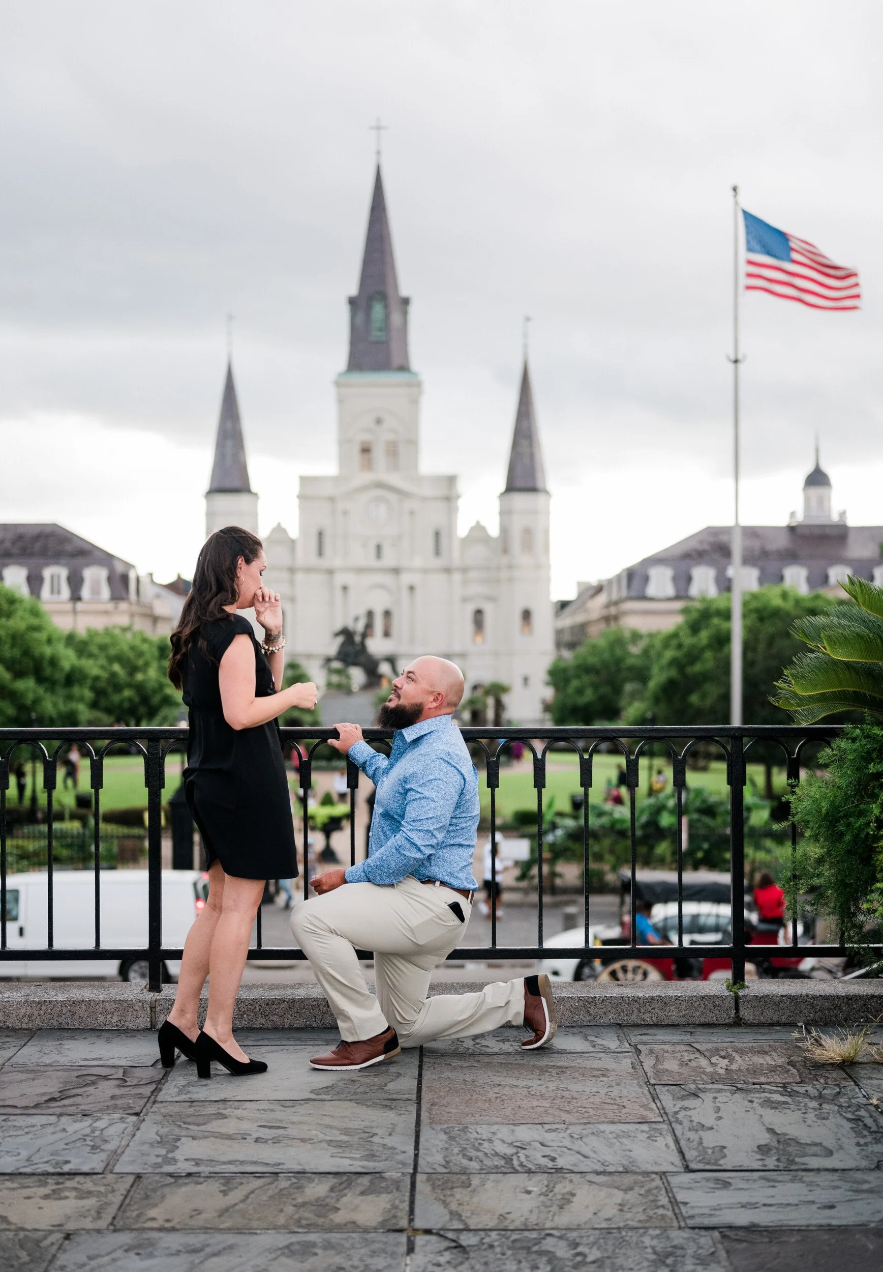 A person on one knee proposing to their partner