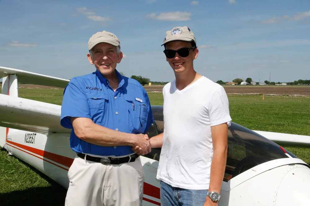 Dak Davis (right) passes his commercial glider check-ride with DPE Gregg Squires in March 2018