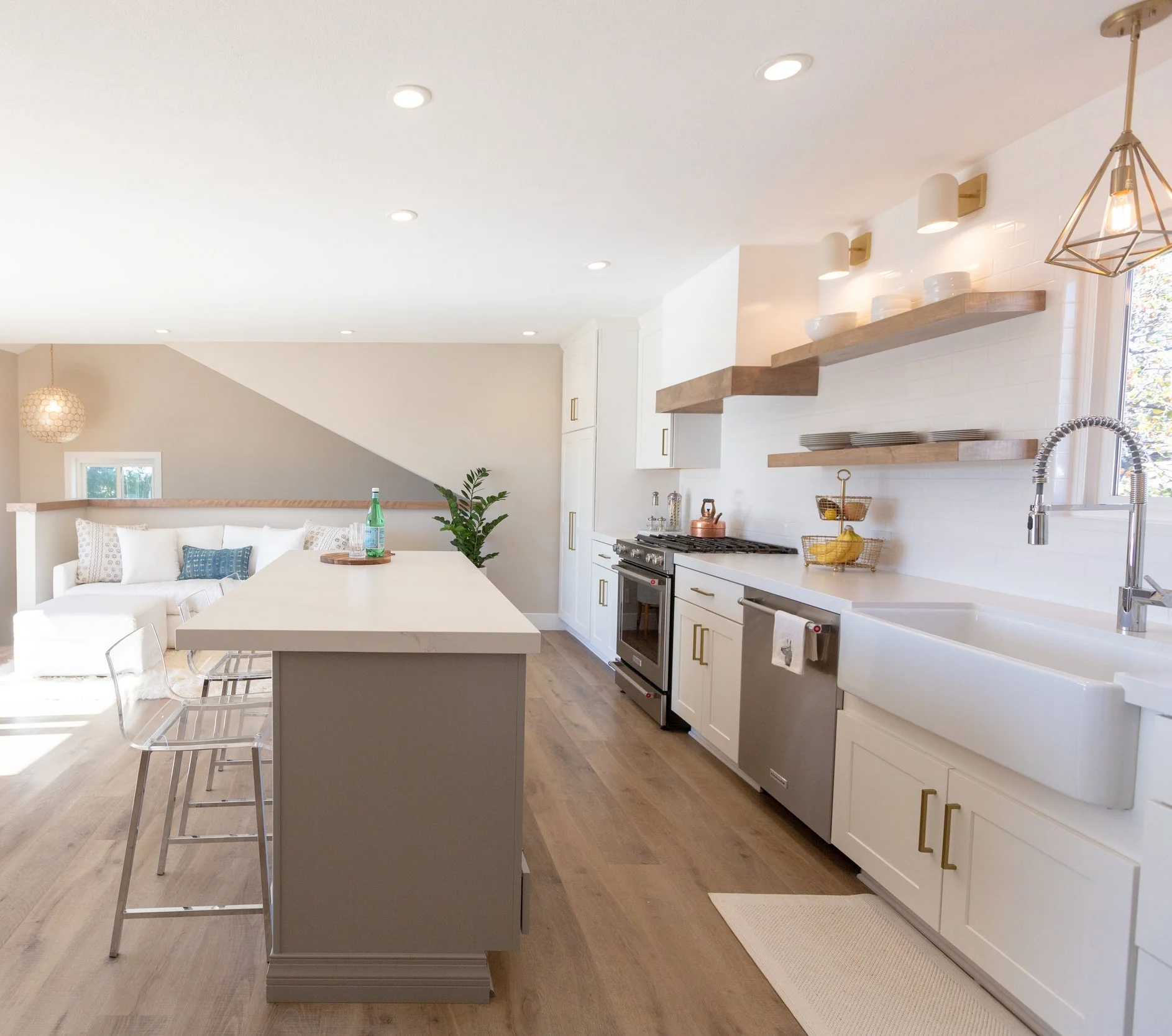 After By demolishing the existing layout we were able to gain so much functional space for our client. Now our client has 44” from cabinet to cabinet and a seamless counter top for optimal efficiency.