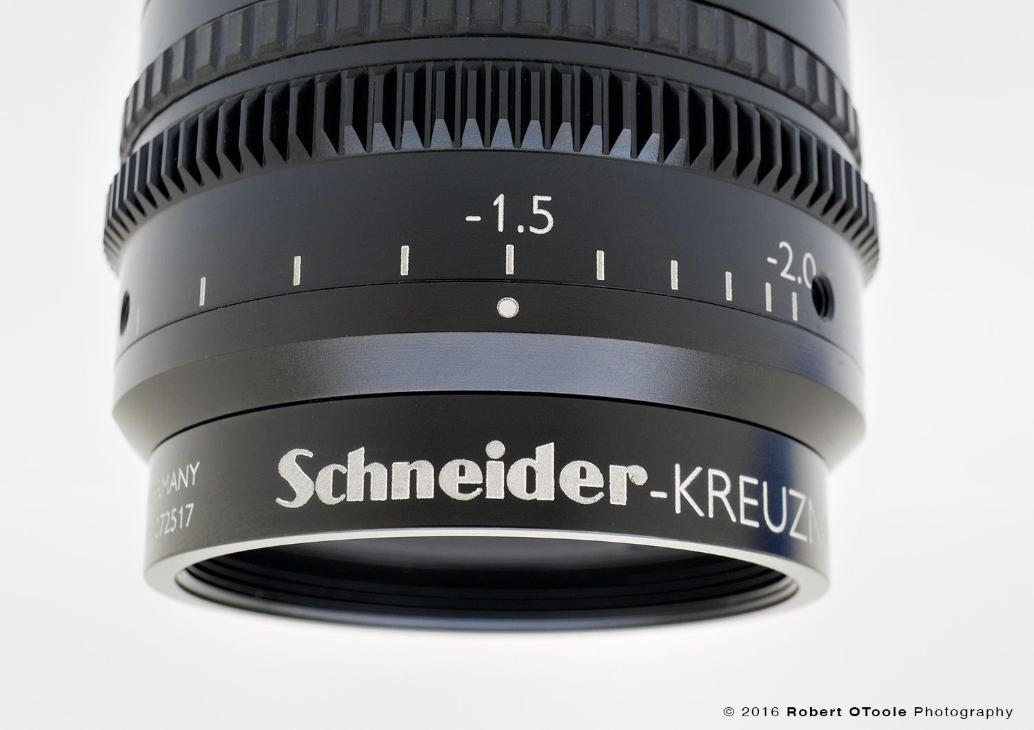 The beta ring, here set to 1.5x, is actually a gear that allows these lenses to be externally motorized in an automated industrial installation. The two threaded holes are for locking set screws.
