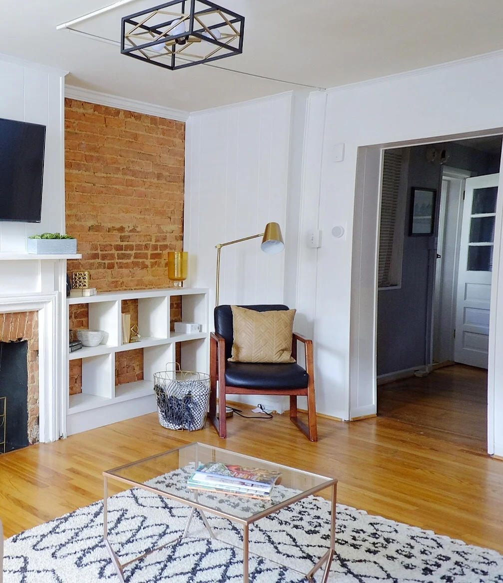 This shelving and exposed brick wall were already here. So pretty!