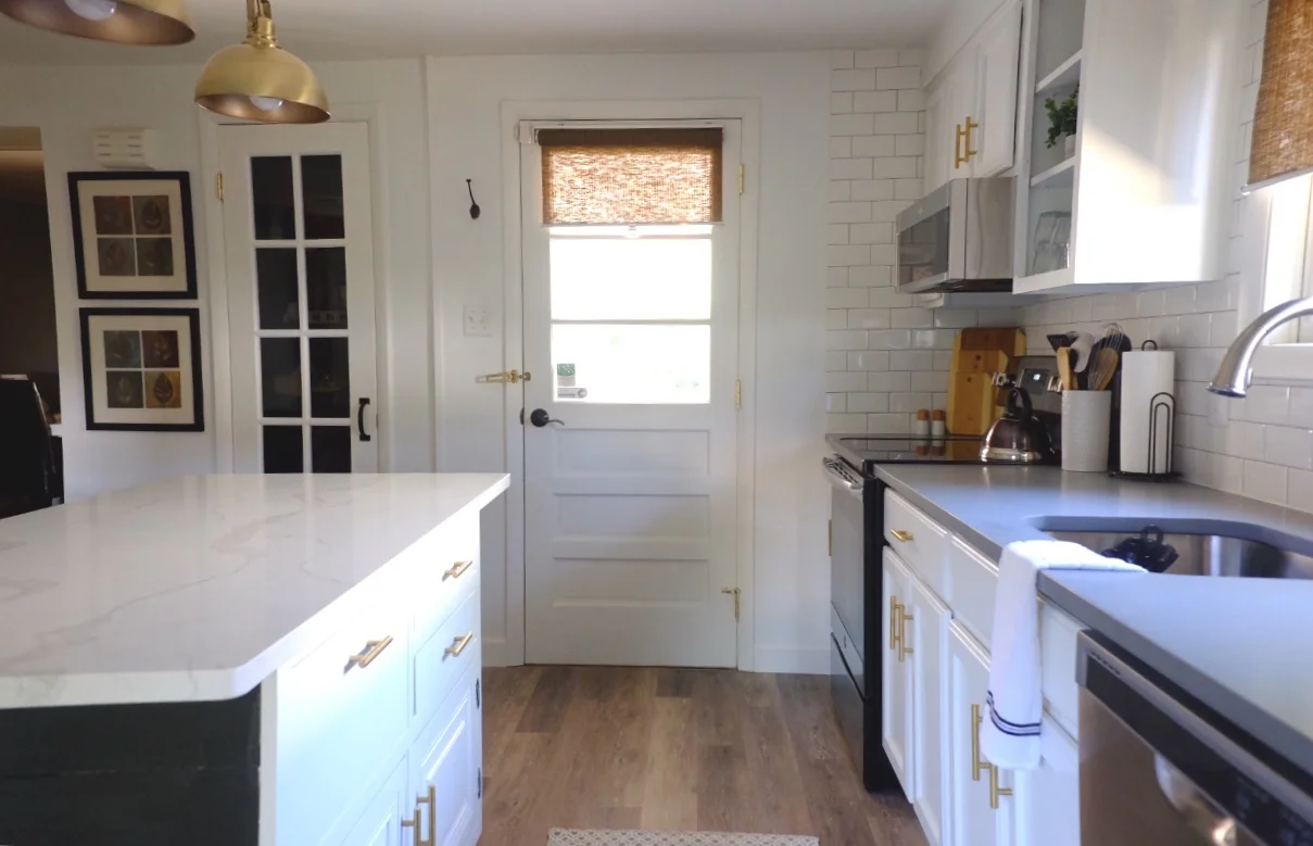 Added gold hardware to the cabinets to tie in the gold lights.