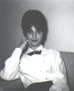 A young camera shy Liz in 1961. Originally, Liz dreamt of becoming a dancer, but found that the visual arts were more suited to her personality. 