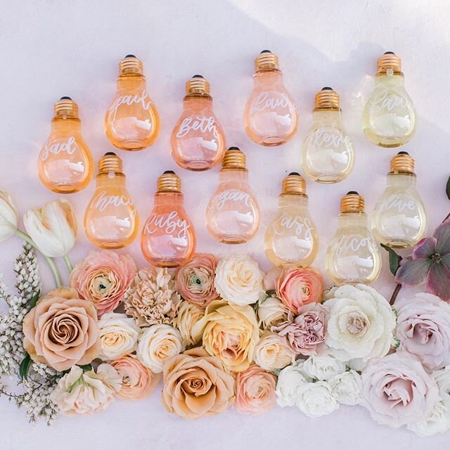 Love this close up @meganwelker snapped of these light bulb &ldquo;place cards&rdquo; from @themilkandhoneyevent! The gals filled them with colored water, giving them this cool ombr&eacute; effect. The bulbs were plastic making them extra durable and