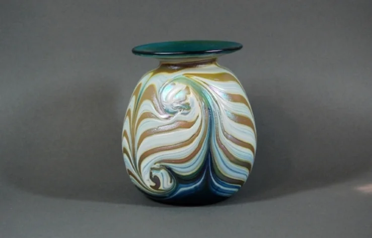 Green vase with white cobra wrap.