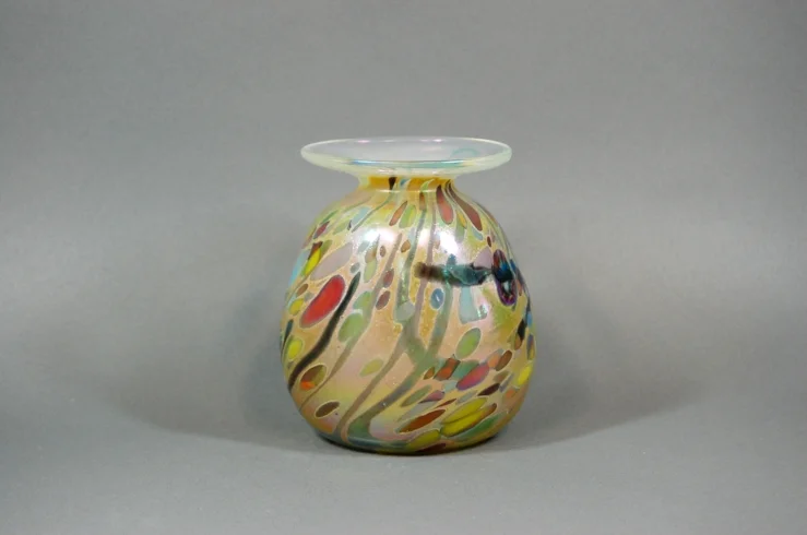 Amber vase with multi colored frit.