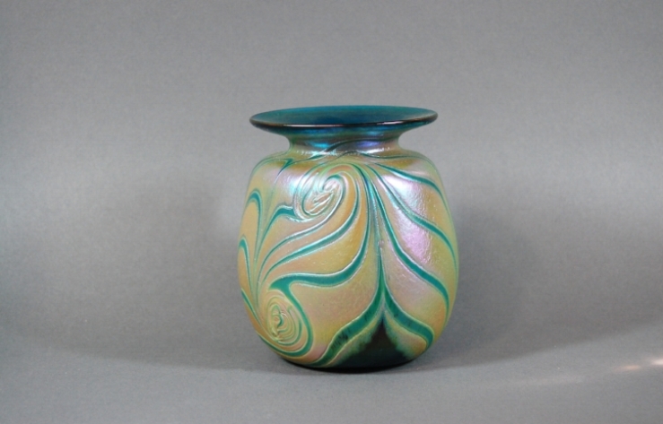 Green vase with cobra wraps.