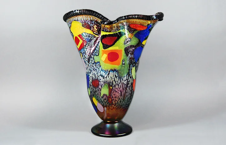 Amber vase with black lip and fused abstract glass.