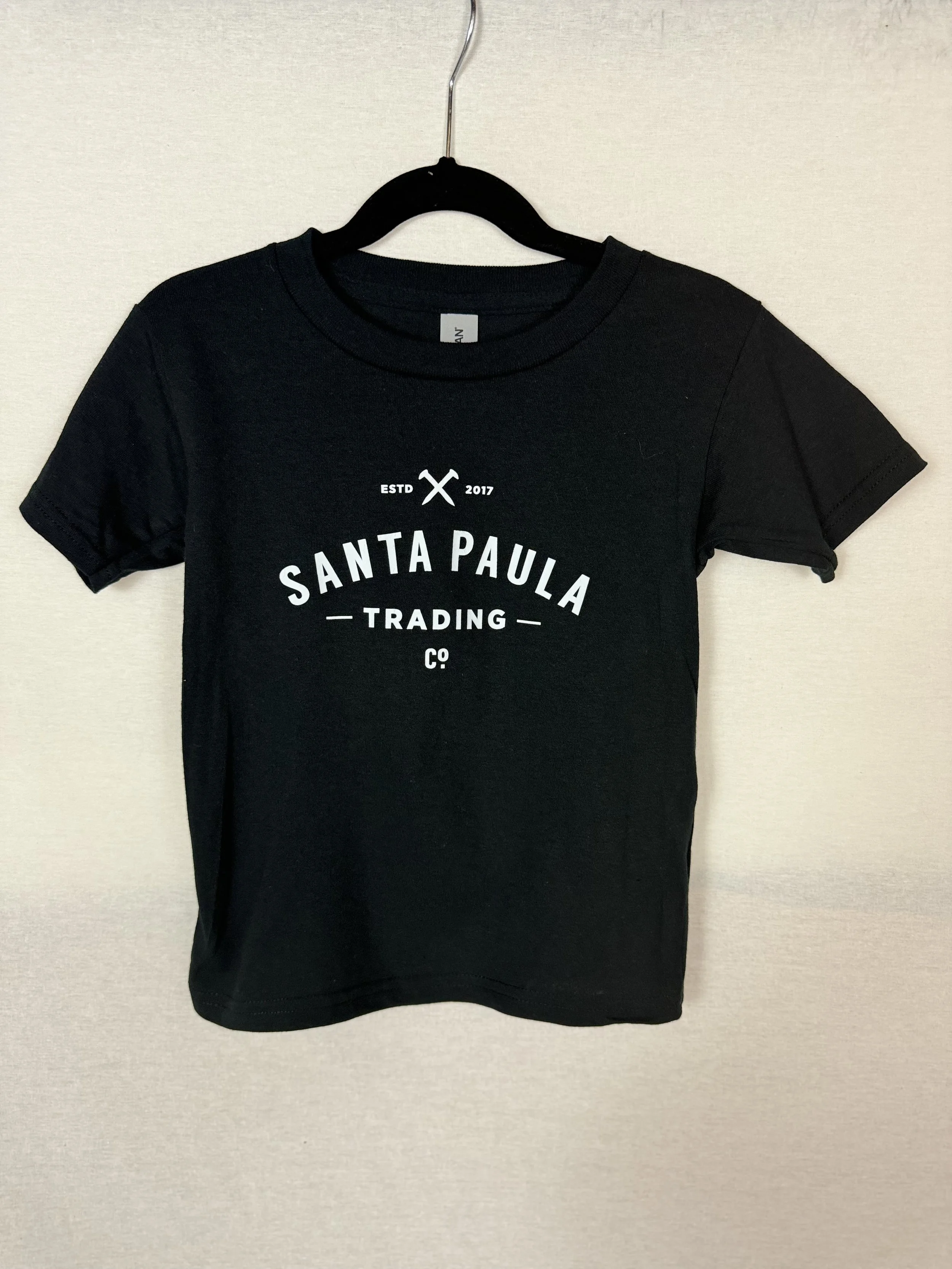 Santa Paula Trading Co Youth Tshirt front view with full logo on chest in Black