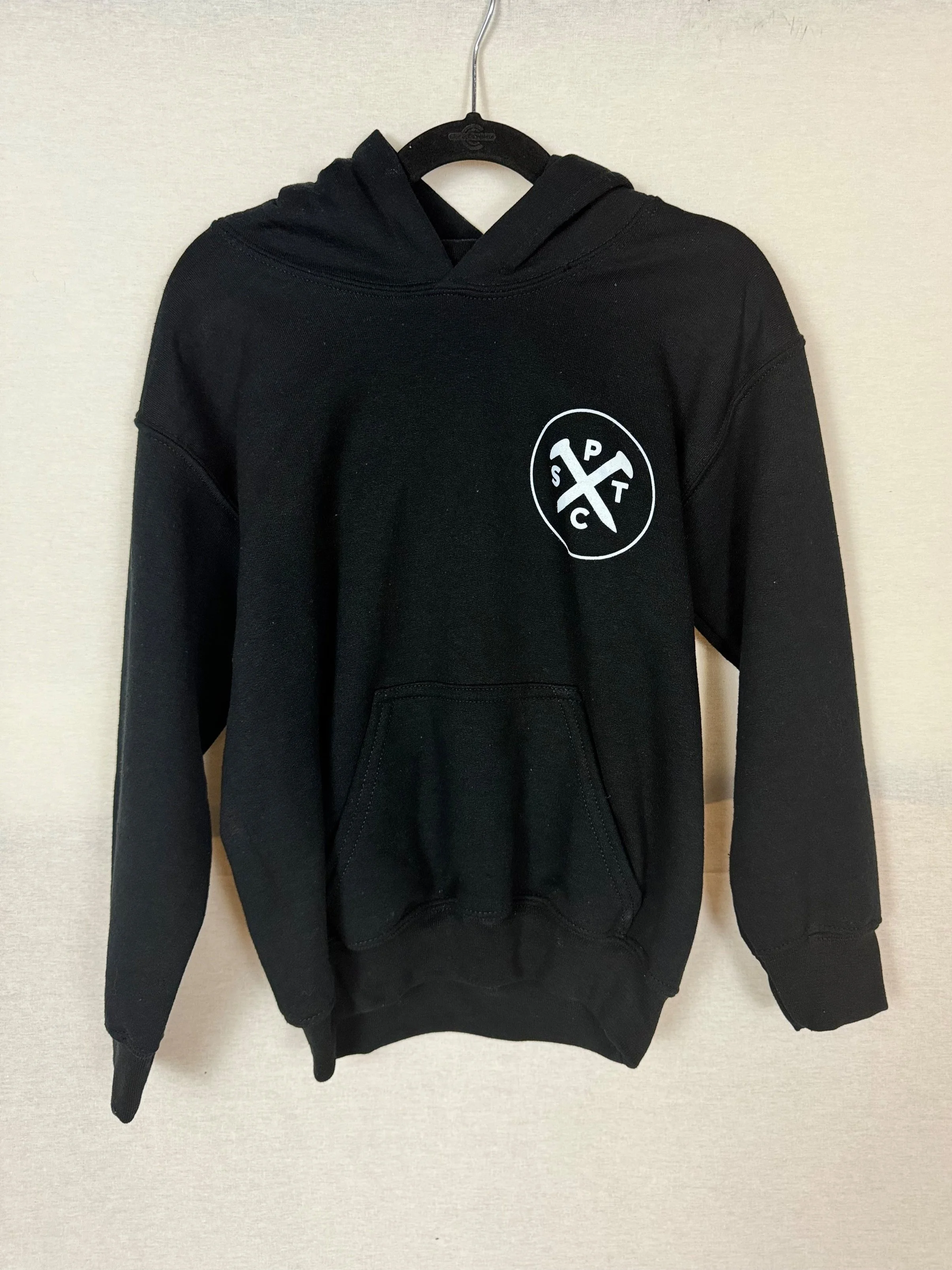 Santa Paula Trading Co Youth hoodie front view with circle logo on left chest in Black