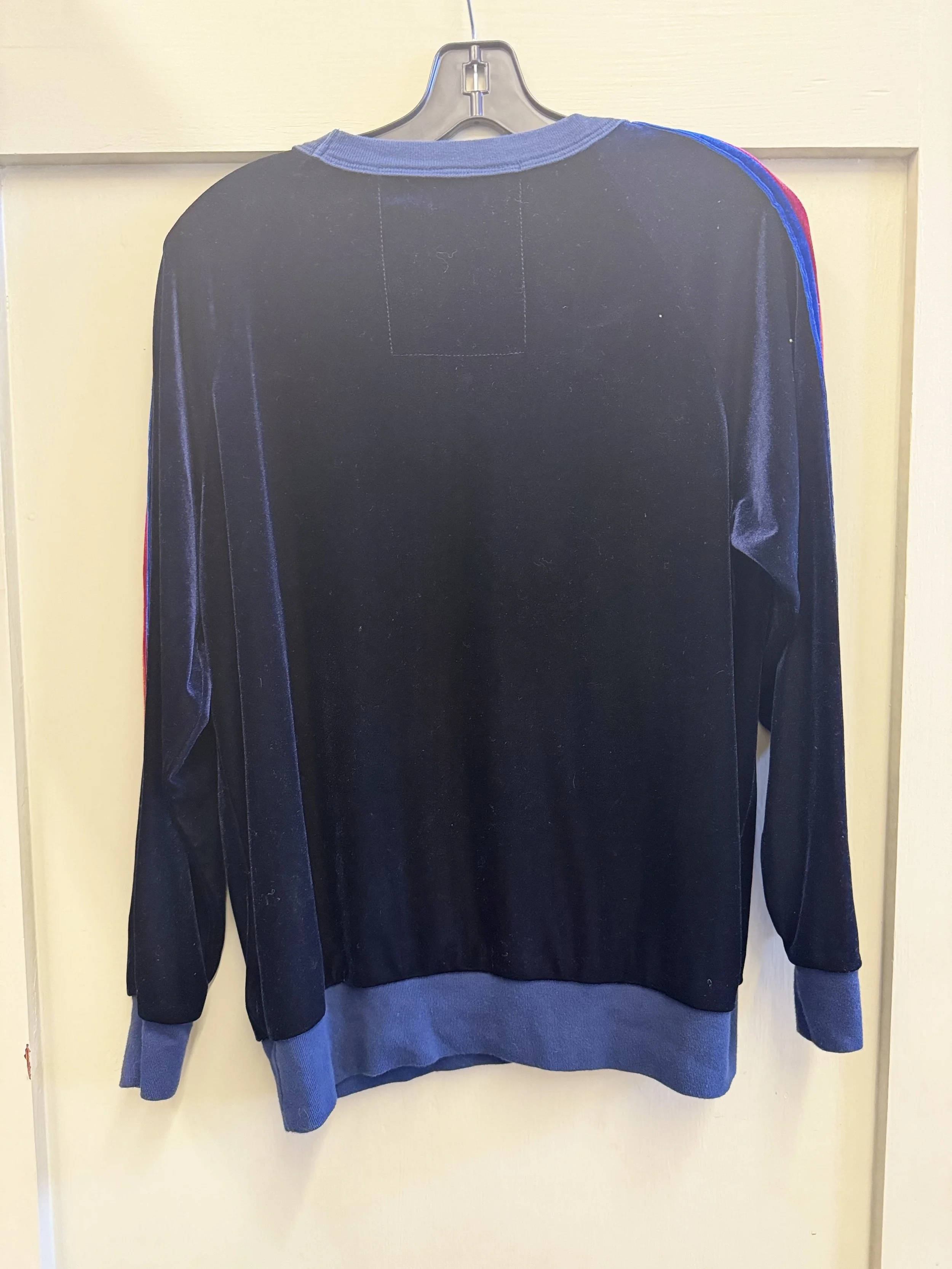 Rear view of Aviator Nation velour striped sweatshirt in black.