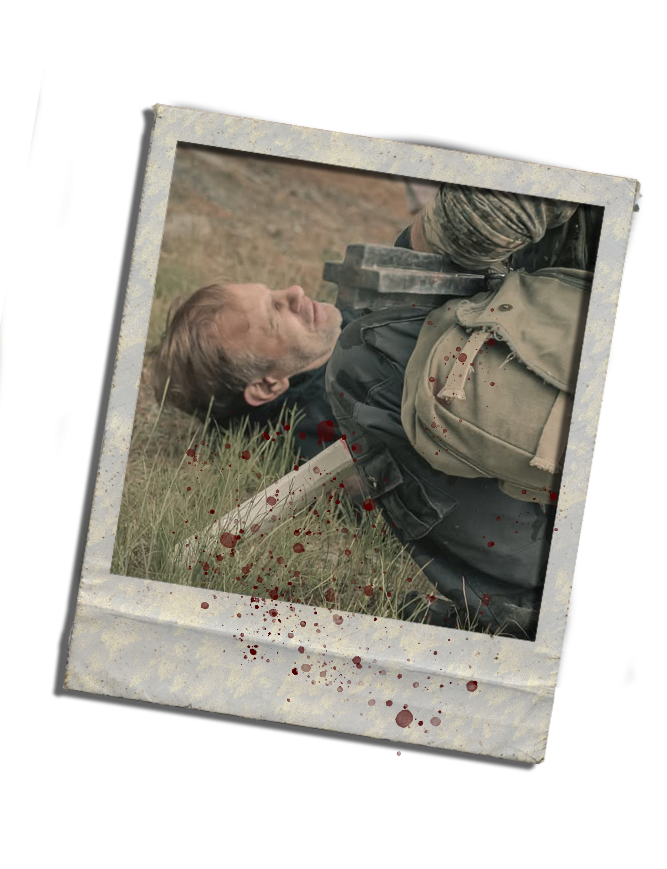 A photograph of a man lying on the ground outdoors, with blood splatters on the photo, and the photo is tilted at an angle.