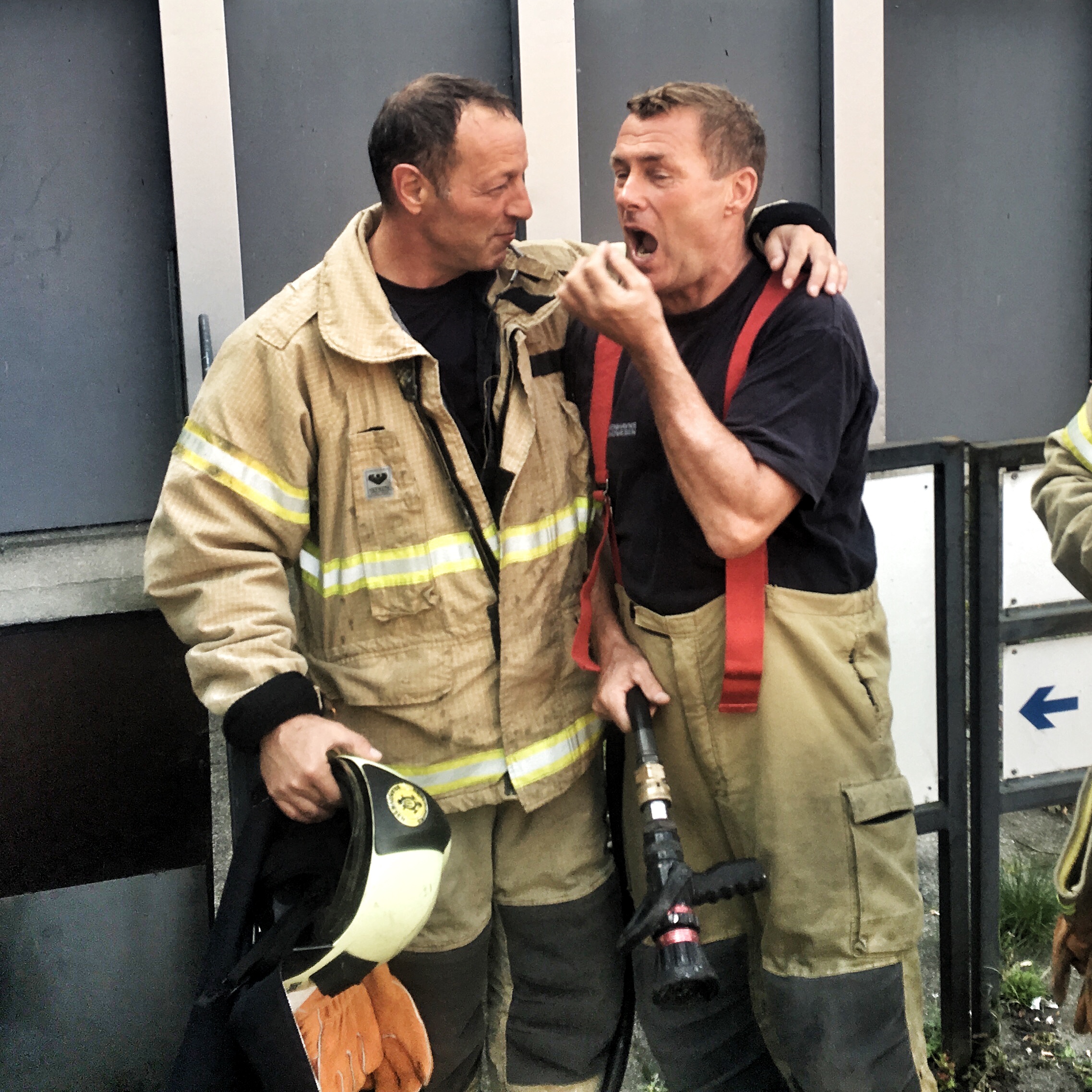 It was this firefighter's last fight - he was retiring the following day, so he ask for pictures with one of the worms - before jokingly gesturing he was going to swallow the burnt one.