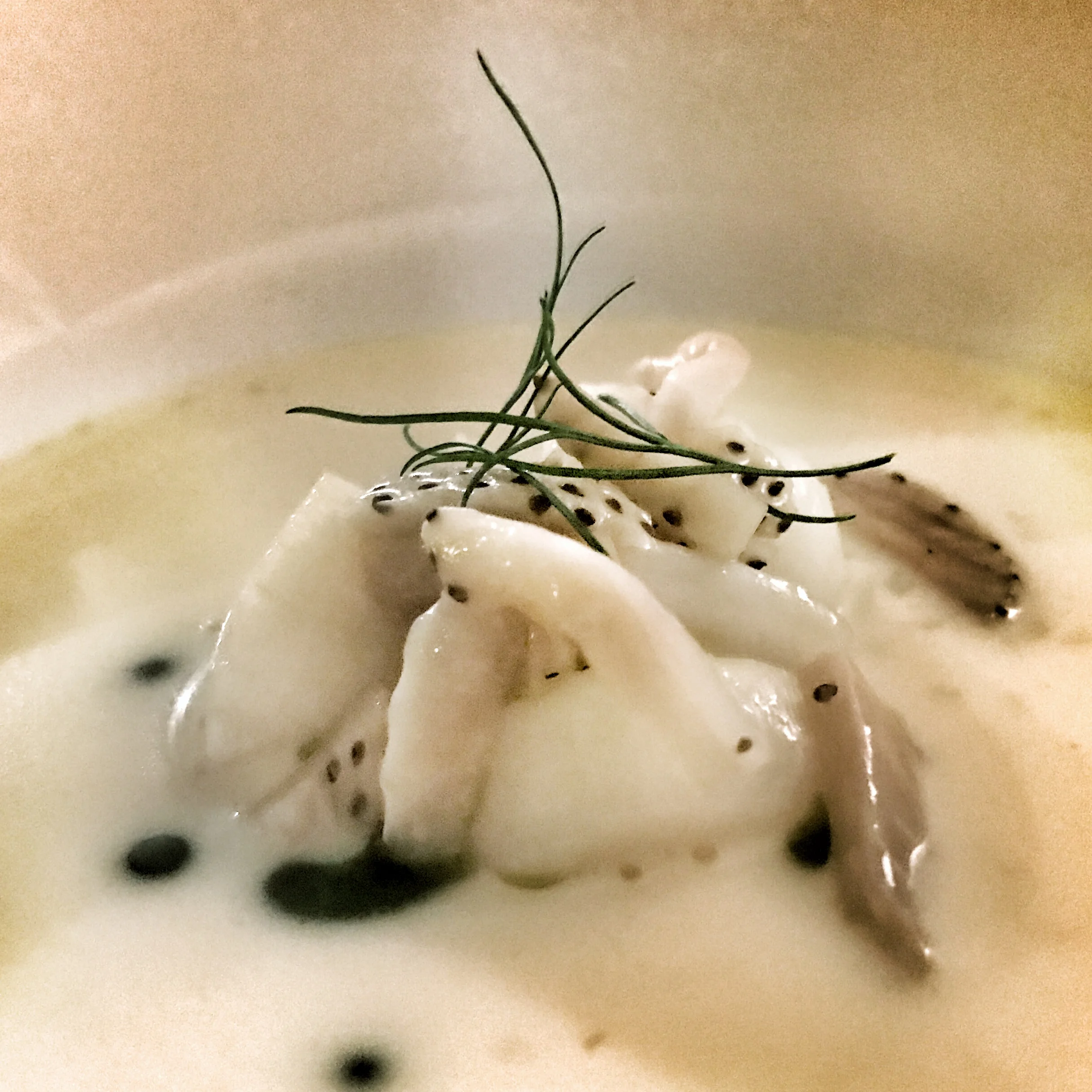 Pickled strawberries piled atop monk fish.