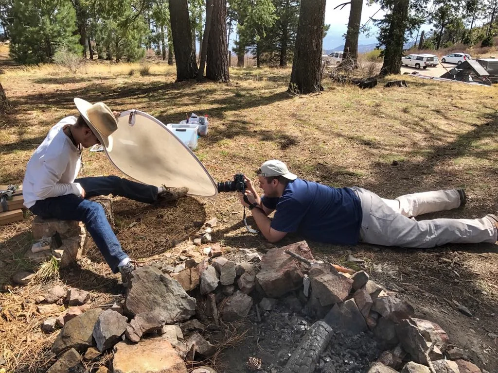 Cousin Mitchell and I were sent off to take some still shots of jewelry - Cousin Taylor got this picture where it looks like we were up to no good! I promise these is a necklace draped on that rock!