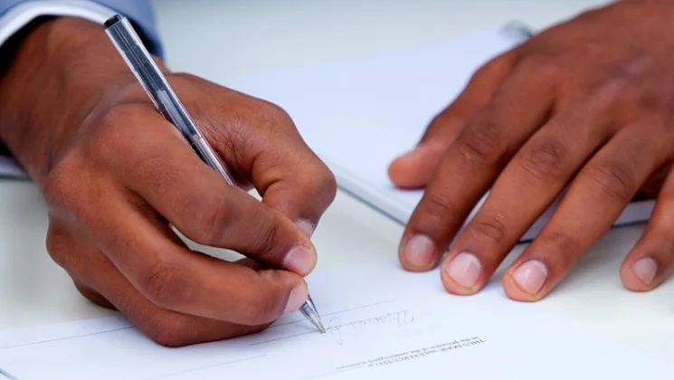 close-up-of-client-signing-documents-fake-signature_hkuzkzpr__S0000.jpg