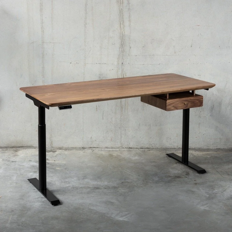 Solid American Walnut
Rich, architectural, unmistakable.
American Walnut is celebrated for its deep chocolate tones and fluid grain movement. 
Each surface reveals layered browns &mdash; from espresso to warm caramel &mdash; with subtle undertones th