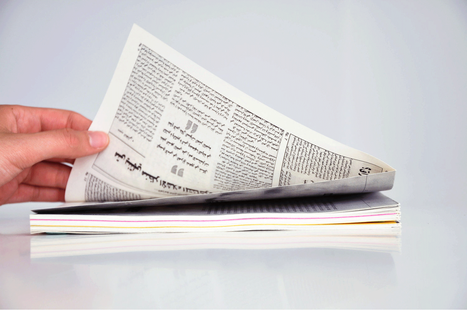Publication for the Mansion Film Club, Beirut. It is cross-folded and bound in a specific way, creating french folds that are exposed from the bottom right corner. The aim is to enable the viewer to peek inside each page, uncovering factual and timely references that are relevant to the fictional films screened at the film club.