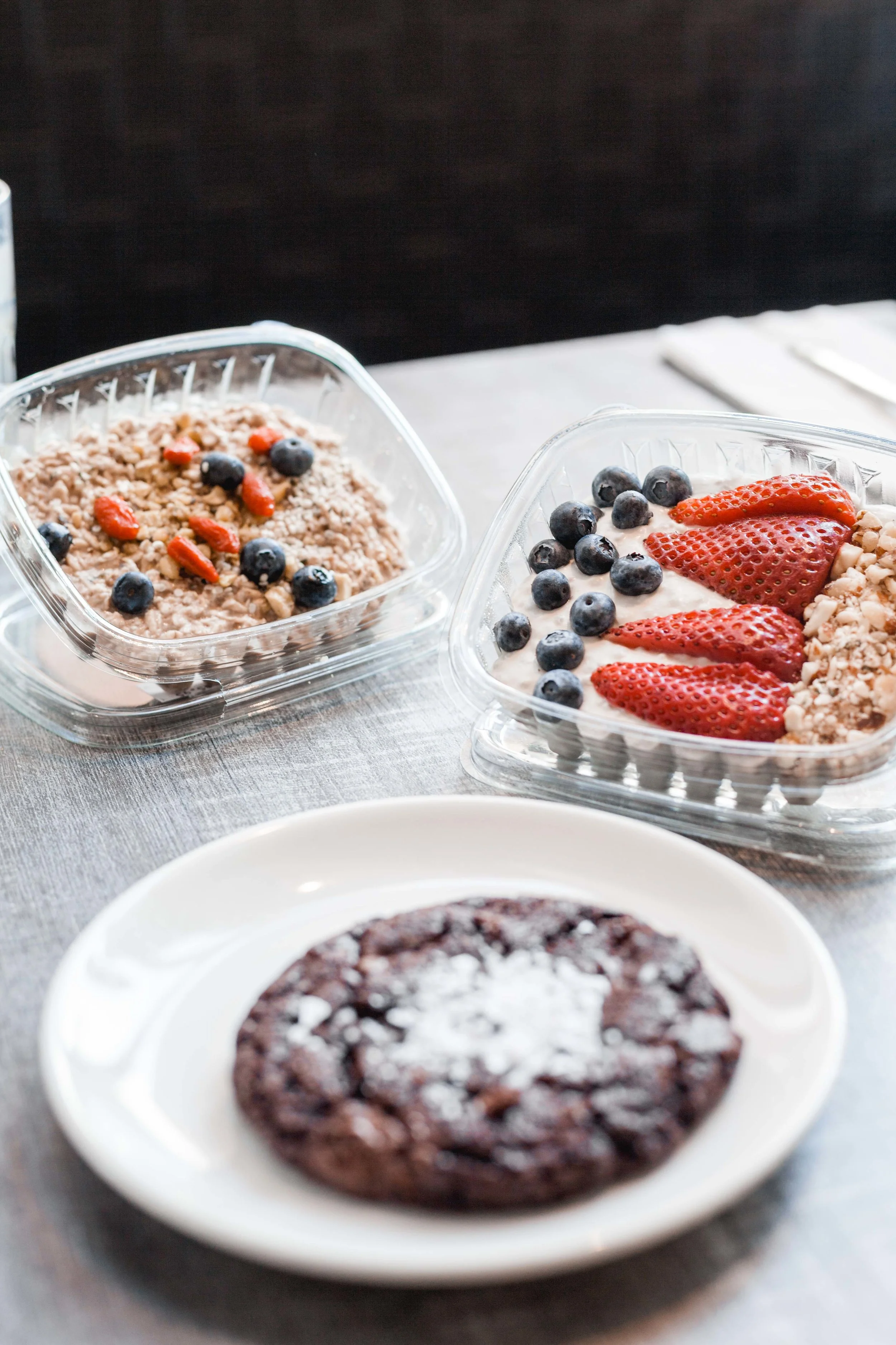 CHIA PUDDING - Chia Seeds, Coconut Milk, Water, Maple Syrup, Vanilla Extract, Blueberries, Strawberries, Nuts and Seeds Topping OVERNIGHT OATS - Rolled Oats, Almond Milk, Almond Butter, Maple Syrup, Goji Berries, Hemp Seeds, Blueberries, Pistachios CHOCOLATE SEA SALT COOKIE - Chocolate Chips, Vanilla Extract, Egg, Almond Flour, Butter, Coconut Sugar, Tapioca Flour, Raw Cacao Powder, Sea Salt Flakes